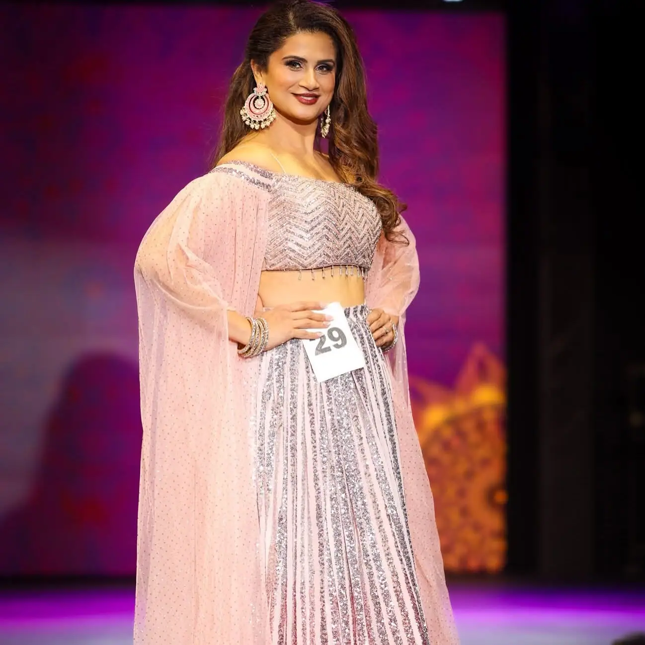 A contestant in a pink Indian lehenga