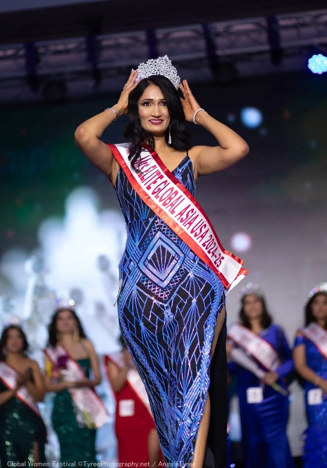 A crowned Global Asia winner on stage