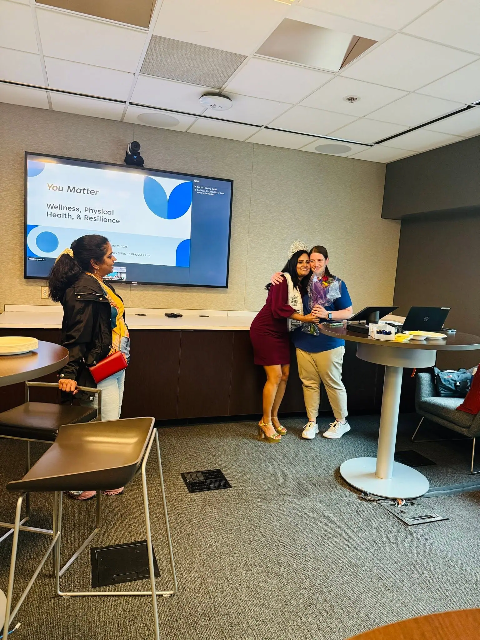 A titleholder at a wellness and resilience talk
