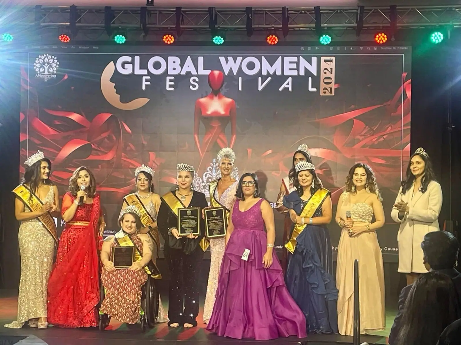 2024 Ms. Empowering Universe honorees with their crowns, sashes and plaques on stage at the Global Women Festival