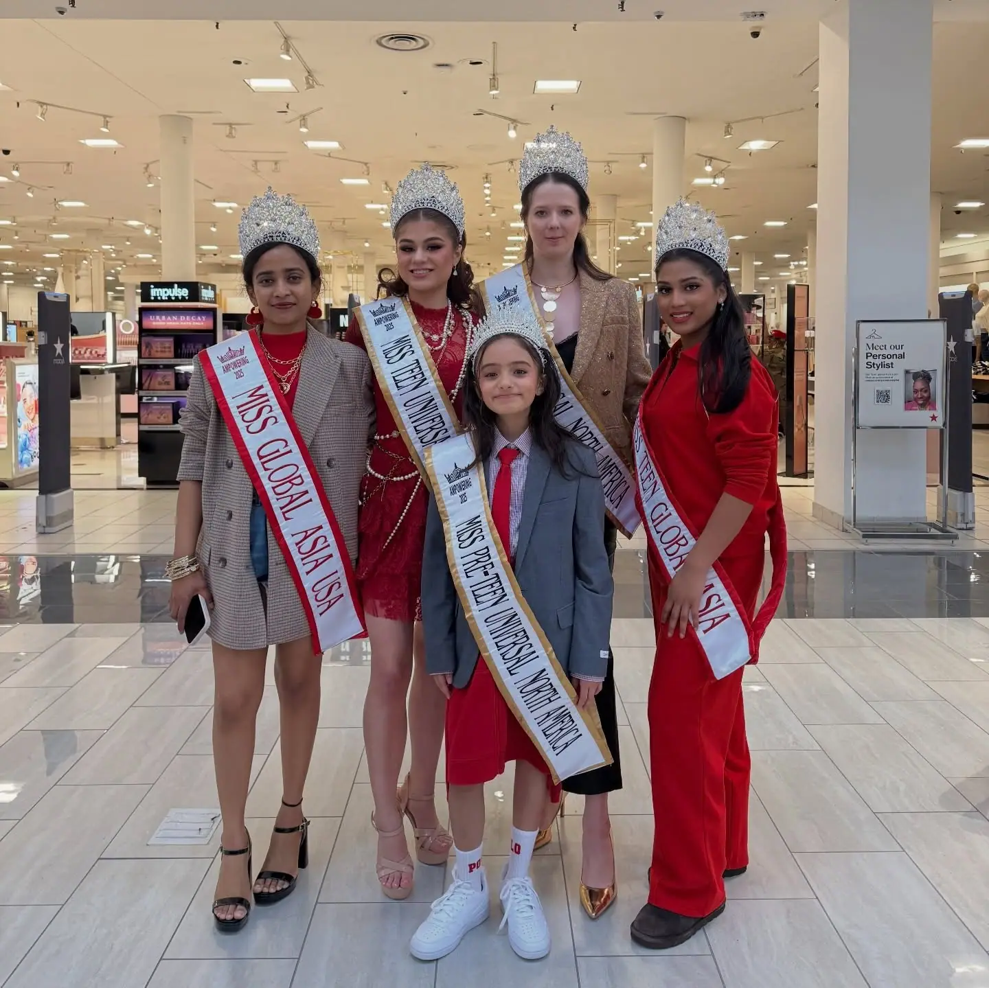 Global Asia titleholders together in their crowns and sashes