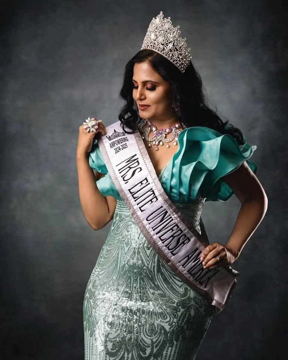 Mrs Elite Universe titleholder in her crown and sash