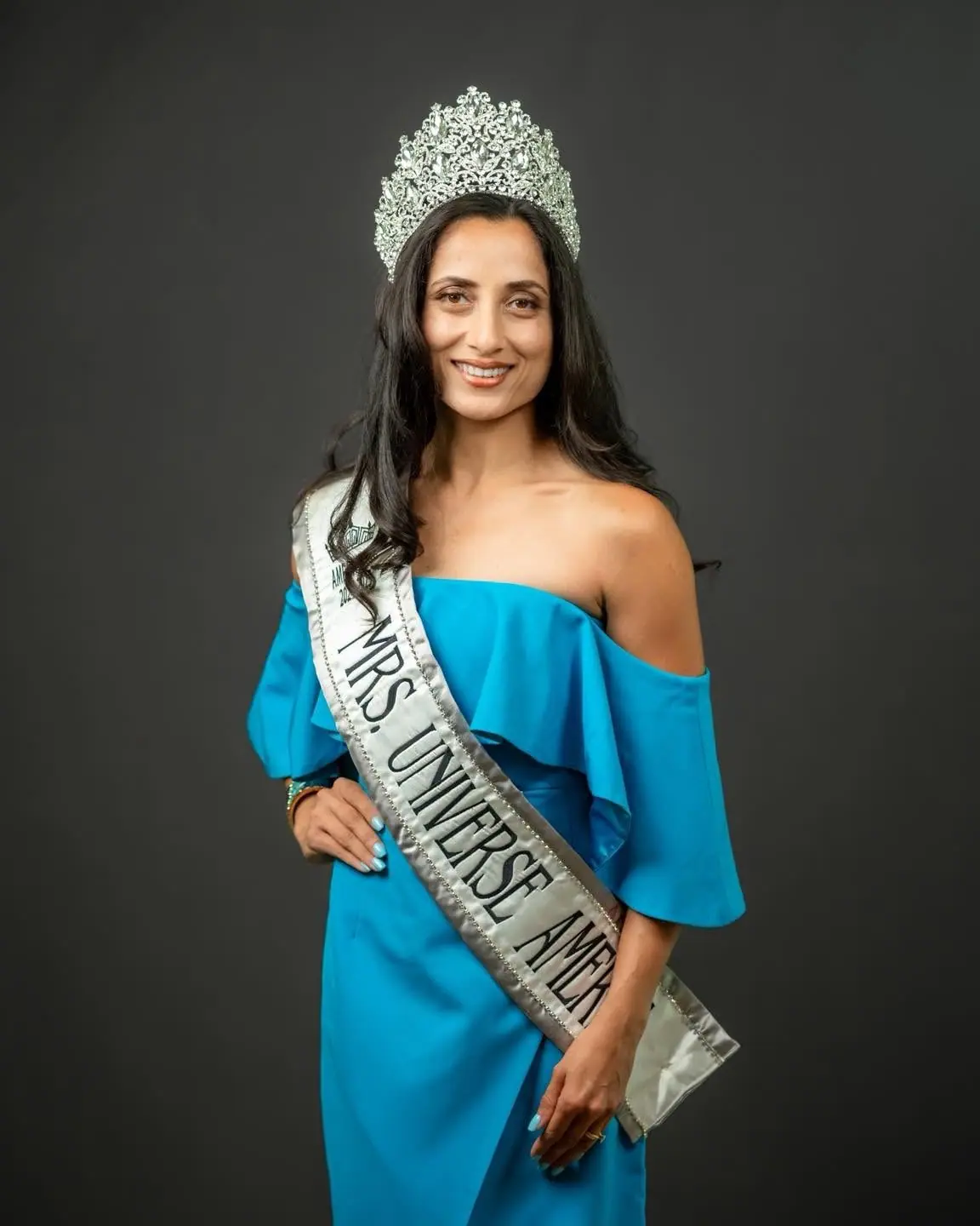Mrs Universe America titleholder in a blue gown